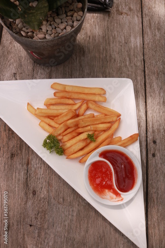 French fries on wooden table