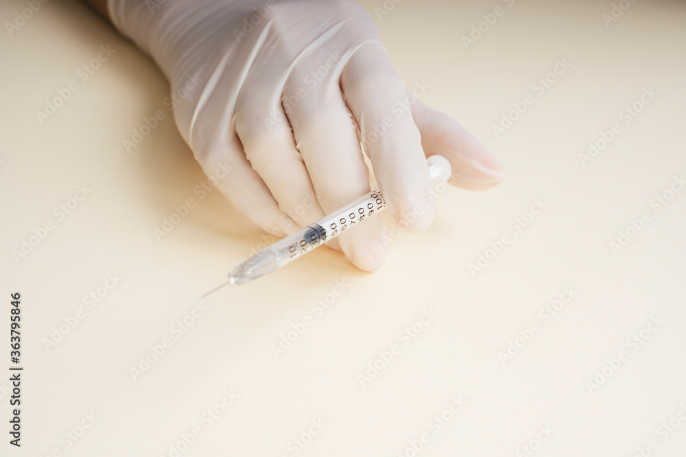 Doctor plastic gloves hand using syringe isolate over white background. Doctor plastic gloves hand using syringe isolate over white background.
