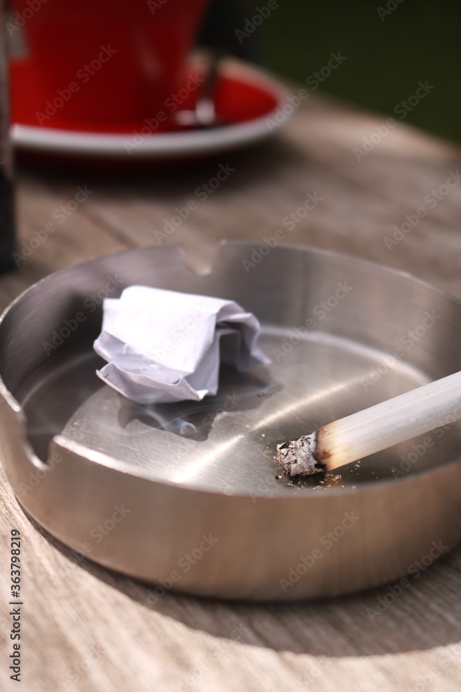 cigarettes burned in an ashtray during the day cigarettes burned in an ashtray during the day