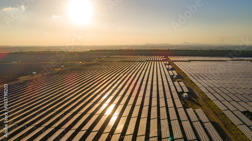 Photovoltaic solar panels at sunrise and sunset.