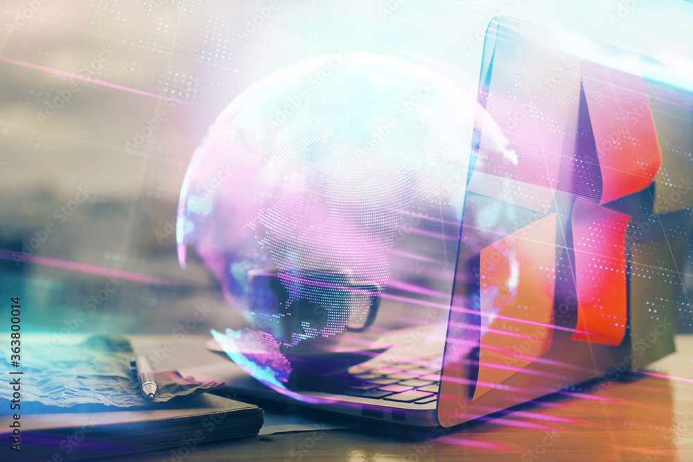 Computer on desktop in office with technology theme hologram. Multi exposure. Tech concept. Computer on desktop in office with technology theme hologram. Multi exposure. Tech concept.