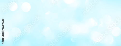 Blue background for the screensaver with a gentle pastel shade, bokeh of the sky. White circles with stains and blurs for a summer card.