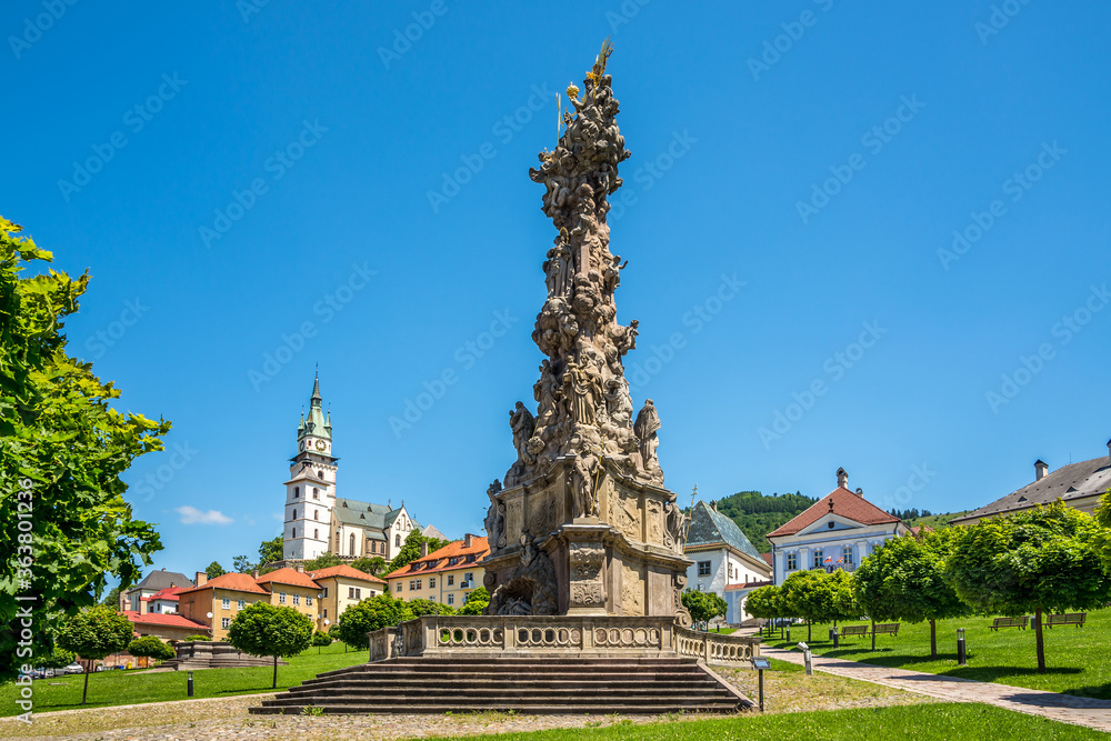 View at the Plague Column of Holy trinity with Town Castle in Kremnica, Slovakia