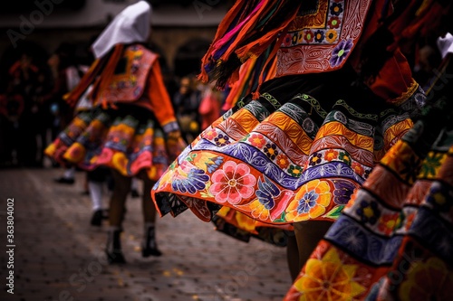 Fotobehang Women Wearing Traditional Clothing While Dancing On Footpath