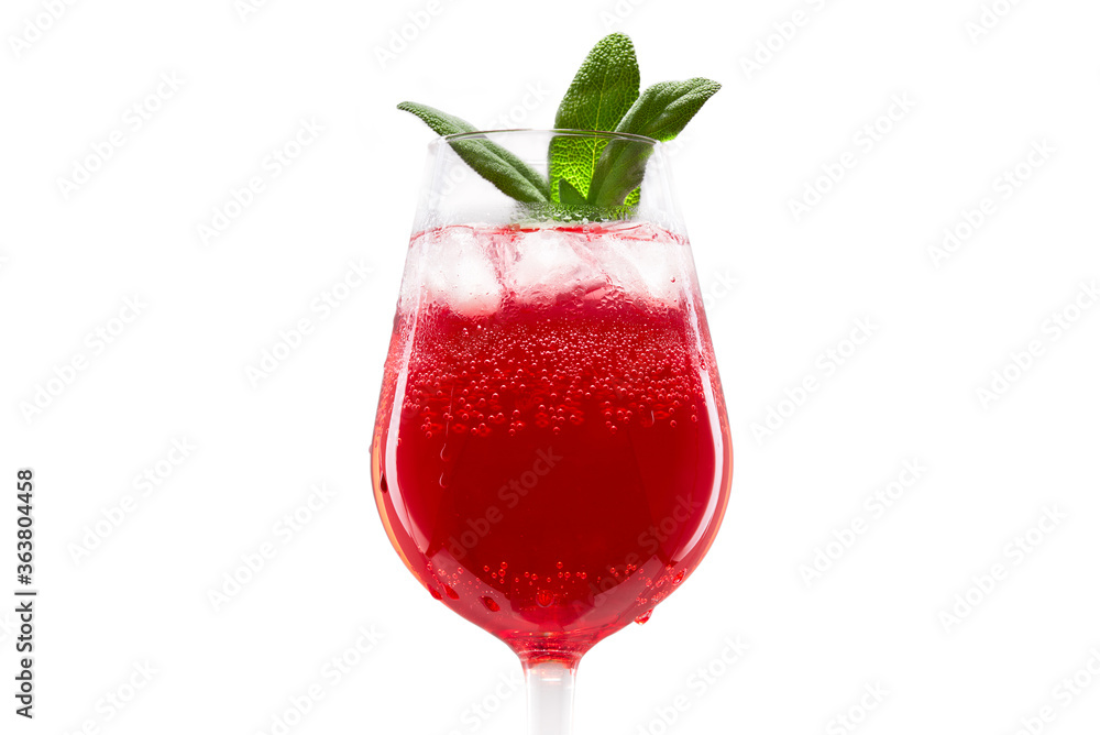 Red cocktail in a glas with ice cubes and mint Red cocktail in a glas with ice cubes and mint