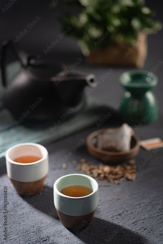 Japanese tea setting on a dark background and winter colours Japanese tea setting on a dark background and winter colours