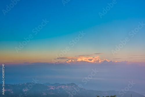 From Tiger Hill in Darjeeling to the Himalayan mountain range after sunrise the mountains are glowing and covered in clouds and fog, the colors of nature are beautiful divided into layers © soumen