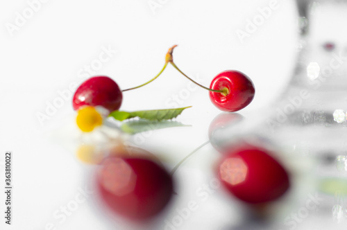 Fresh cherry in a tall glass isolated on white background. fresh ripe cherries. sweet cherries.