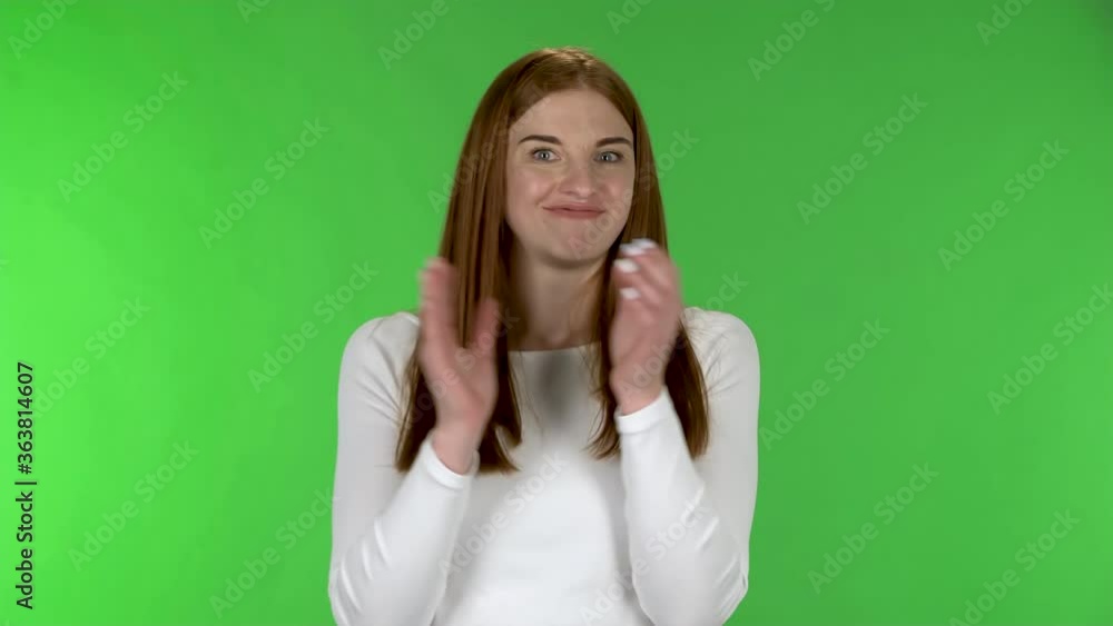 Portrait of pretty young woman is clapping her hands with wow happy joy. Portrait of pretty young woman is clapping her hands with wow happy joy.