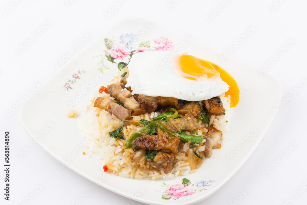 Rice topped with stir-fried pork and basil with fried egg