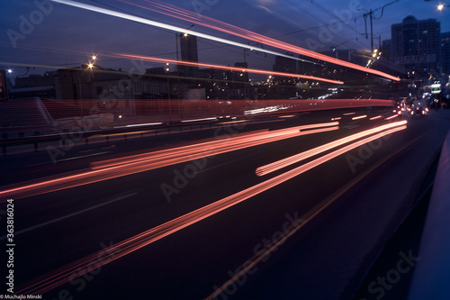 long flying futuristic red lines on a dark night