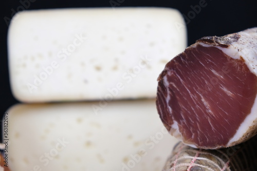 Tavolo con salumi e norcineria. Salame, prosciutto, porchetta, formaggio, lonza, lonzino, galantina photo