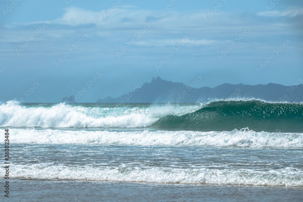 Pacific Ocean waves crashing on the beach. Whangarei, New Zealand