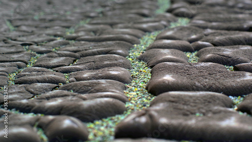 Cracked waterproofing and pebbles on cracks