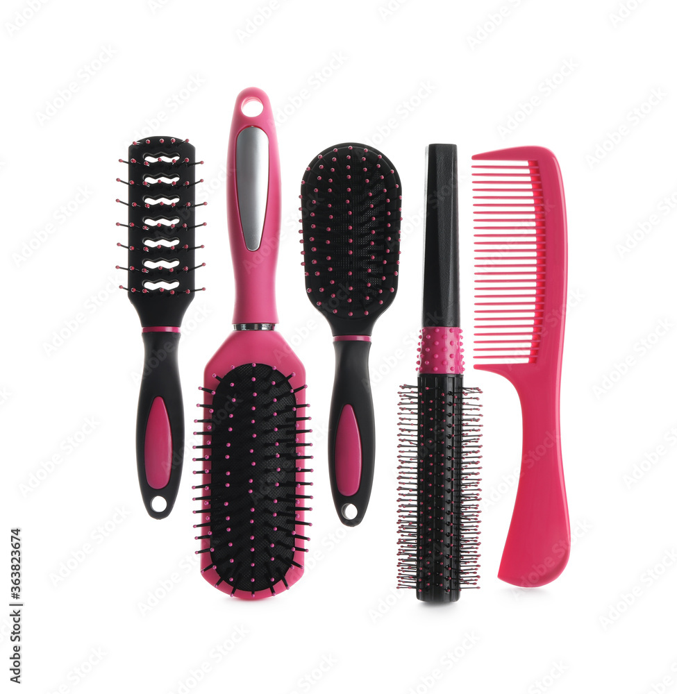 Set of professional hair brushes and comb isolated on white, top view Set of professional hair brushes and comb isolated on white, top view