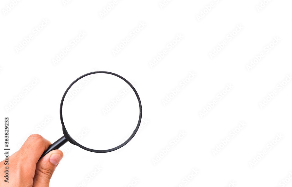 Male hand holds a magnifying glass on a white background Male hand holds a magnifying glass on a white background