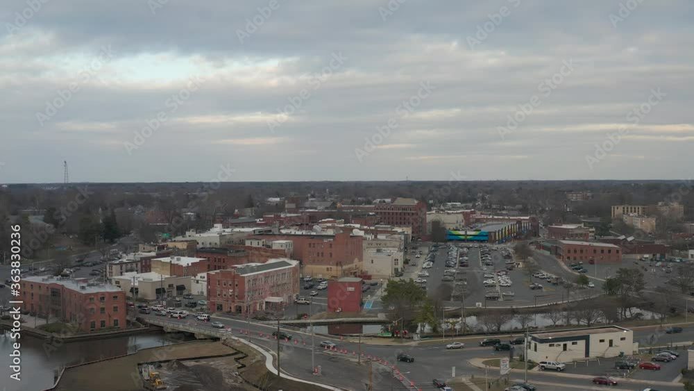 Aerial view of businesses and traffic along a river coast. Aerial view of businesses and traffic along a river coast.