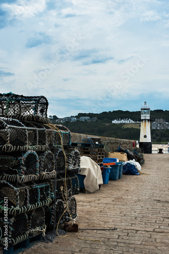 View of Lighthouse on Smeatons Pier in St. Ives beach at low tide in Cornwall in England photo