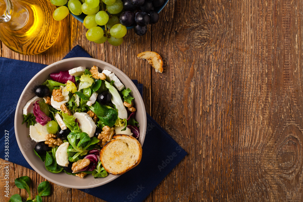 Italian spring salad with goat cheese, grapes and walnuts. Served with croutons. Italian spring salad with goat cheese, grapes and walnuts. Served with croutons.