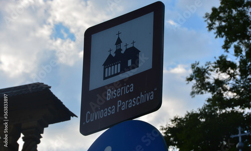 Obraz na płótnie DESESTI, MARAMURES, ROMANIA, SUMMER 2018. Indicative sign of the beautiful wooden orthodox church of San Parascheva or Desesti. w salonie