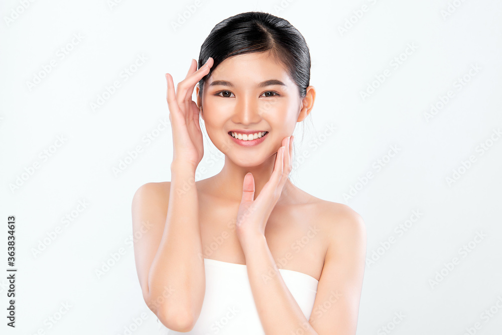 Beauty face. Smiling asian woman touching healthy skin portrait. Beautiful happy girl model with fresh glowing hydrated facial skin and natural makeup on white background, Beauty face. Smiling asian woman touching healthy skin portrait. Beautiful happy girl model with fresh glowing hydrated facial skin and natural makeup on white background,