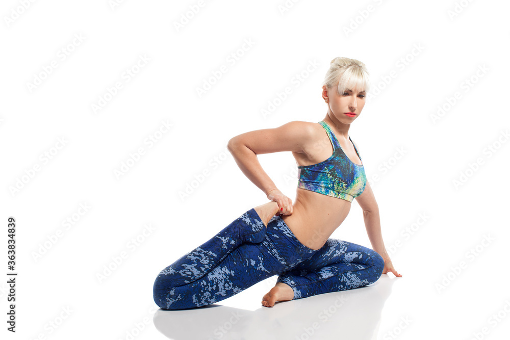 Beautiful blond woman doing yoga practice isolated on white background Beautiful blond woman doing yoga practice isolated on white background