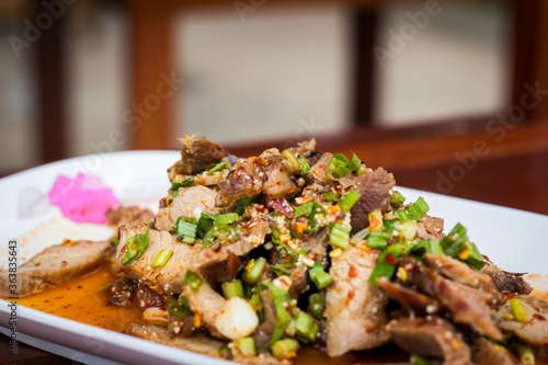 Thai food name is Grilled pork with spicy salad, Thai food photo