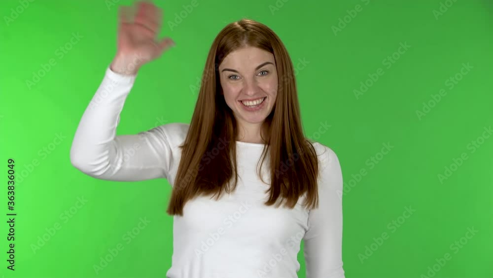 Portrait of pretty young woman is waving hand and showing gesture come here. Portrait of pretty young woman is waving hand and showing gesture come here.