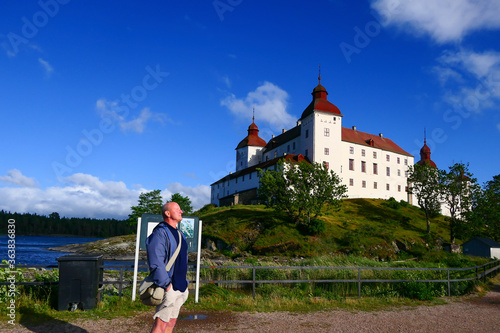 Lidkoping, Sweden  A tourist at the medieval Lacko Castle on the southern shore of Lake Vanern photo