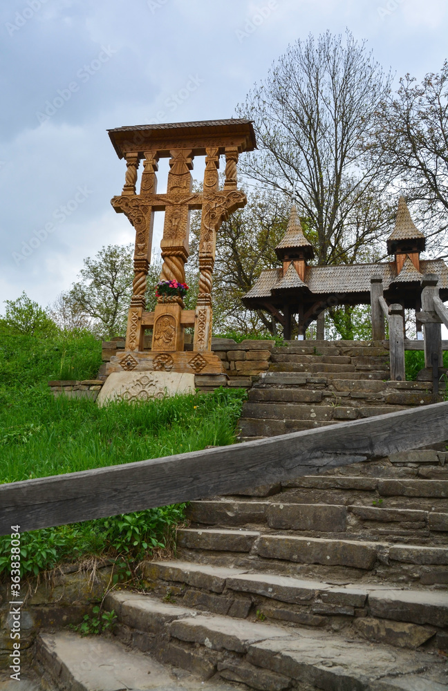DESESTI, MARAMURES, ROMANIA, SUMMER 2018. Entrance to the beautiful wooden orthodox church of San Parascheva or Desesti, Unesco World Heritage.