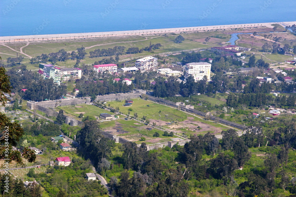 View of Gonio Apsaros Fortress, Black Sea beach and surrounding apartment buildings. Georgia, Gonio