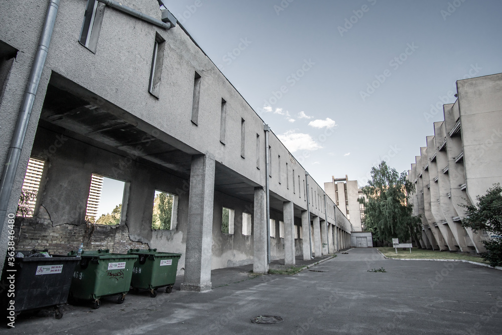 KIEV, UKRAINE - JULY, 2020: Empty courtyard of Taras Shevchenko National University of Kyiv. Courtyard of obsolete gray concrete buildings in the style of modernism.