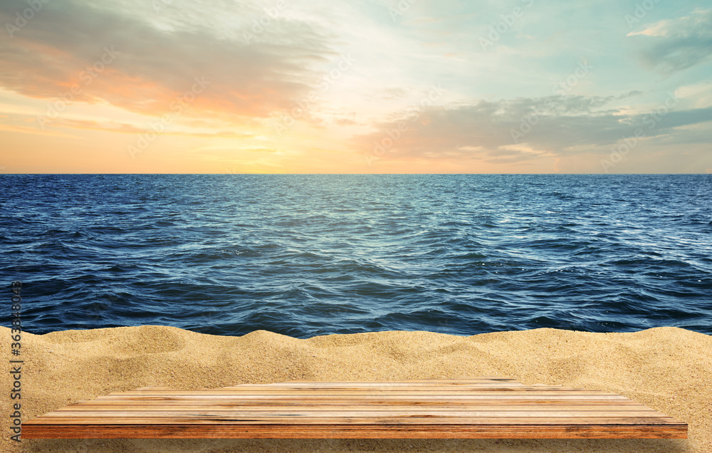 Wooden table top on blue sea and white sand beach background.  