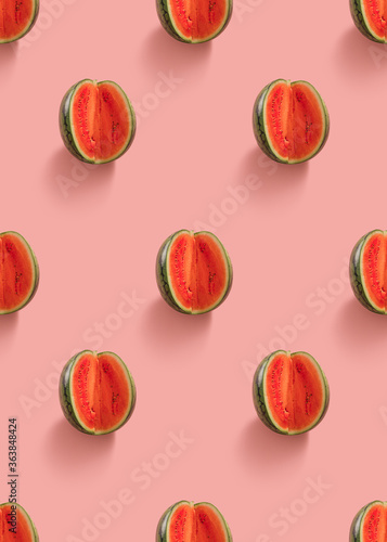 Watermelon slice seamless pattern on pastel pink background. Minimal fruit concept.