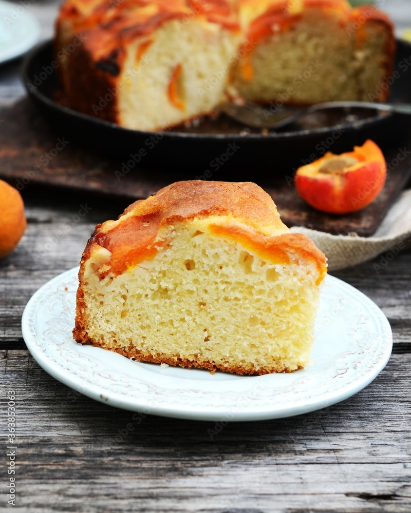 Cake with apricots on a wooden table in the garden, still life Cake with apricots on a wooden table in the garden, still life