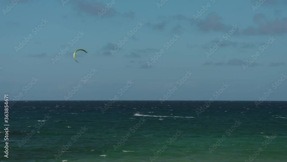 Kite surfer catches air on west Maui during a windy day. Kite surfer catches air on west Maui during a windy day.