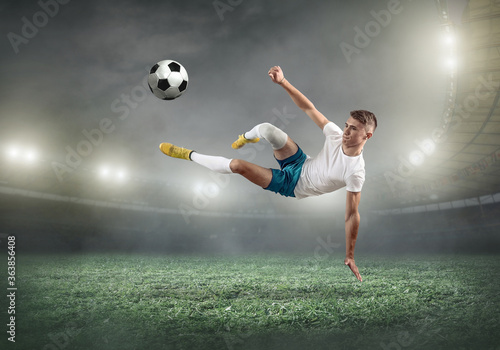 Soccer player on a football field in dynamic action at 