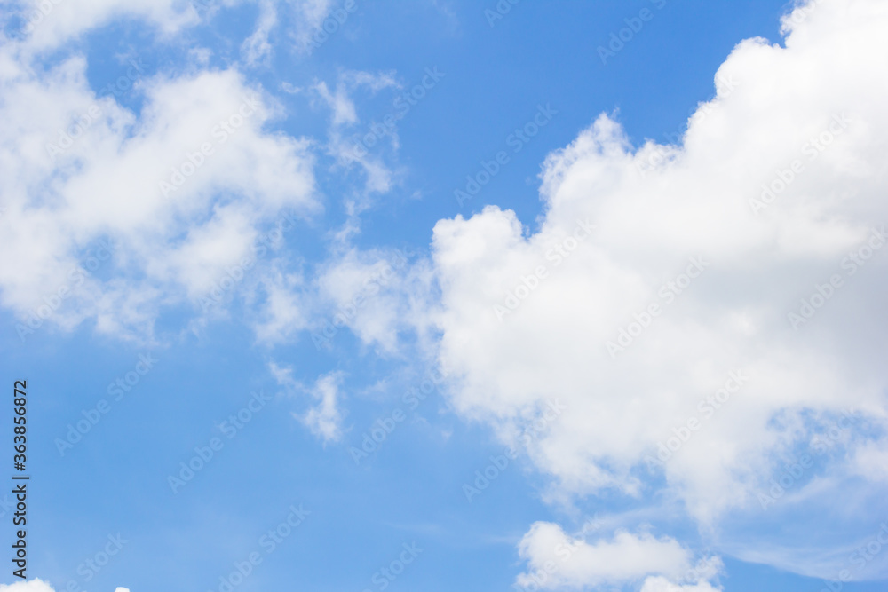 Fototapeta premium Fantastic soft white clouds against blue sky