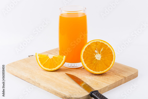 Orange juice and slices of orange on white background