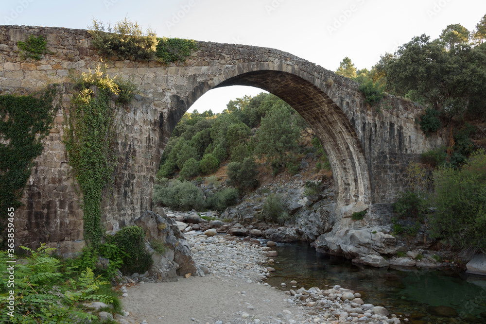 Roman bridge in the Alardos gorge in Madrigal de la Vera, Caceres, Extremadura, Spain, Europe. Stone construction.