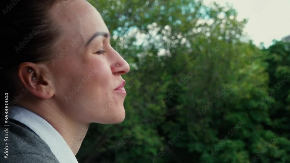 Young woman drinks coffee looking out the window Young woman drinks coffee looking out the window