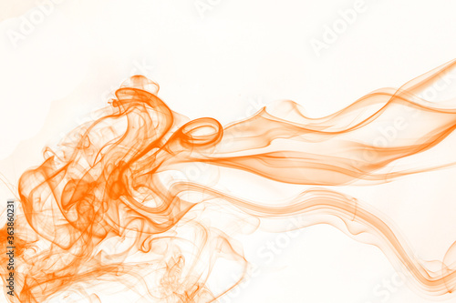 Orange smoke on white background, orange ink background, movement of orange smoke