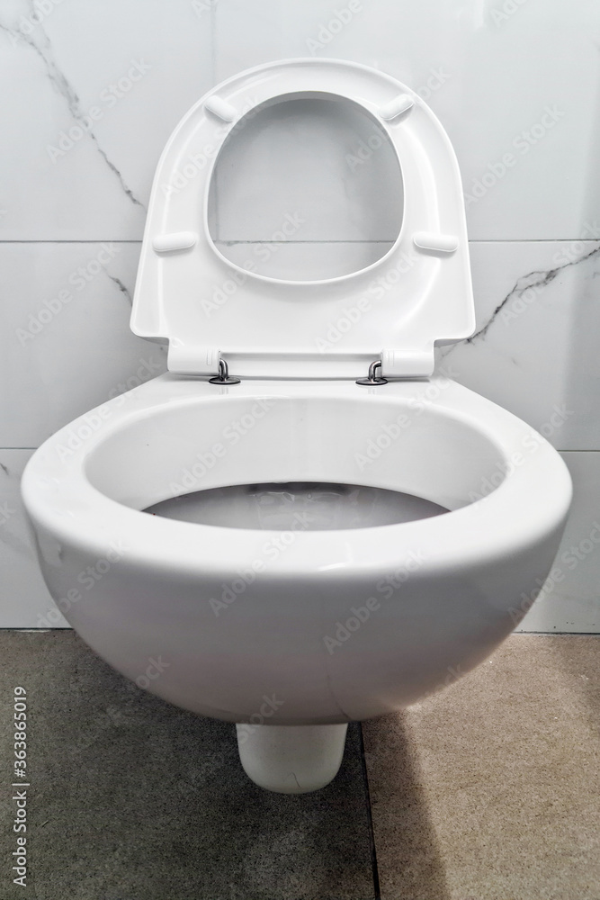 Closeup toilet in the bathroom. Public toilet in the airport or restaurant, cafe. Closeup toilet in the bathroom. Public toilet in the airport or restaurant, cafe.