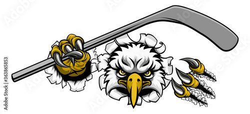 An eagle ice hockey player animal sports mascot holding a hockey stick