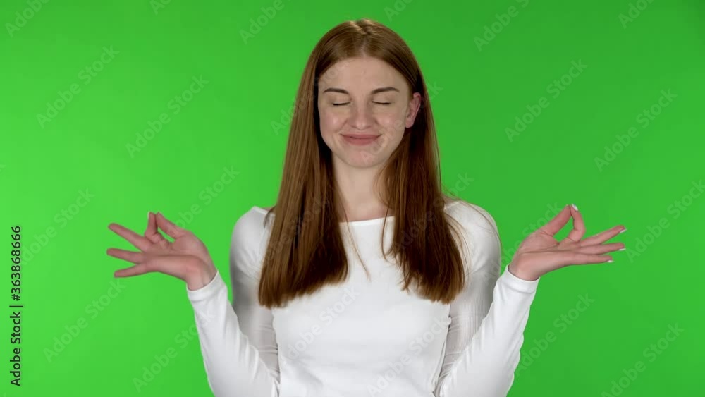 Portrait of pretty young is relaxing, meditating. Portrait of pretty young is relaxing, meditating.