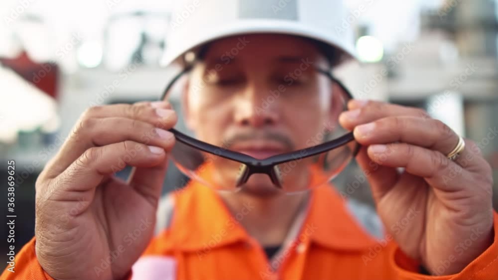 Filipino deck Officer on deck of vessel or ship , wearing PPE personal