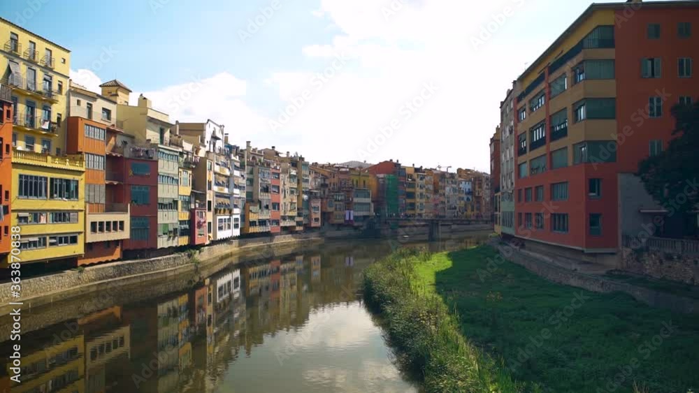 GIRONA, SPAIN - OCTOBER 5, 2019: Panoramic view of Gerona river, colorful river houses, on October 5, 2019 in Girona Spain. GIRONA, SPAIN - OCTOBER 5, 2019: Panoramic view of Gerona river, colorful river houses, on October 5, 2019 in Girona Spain.
