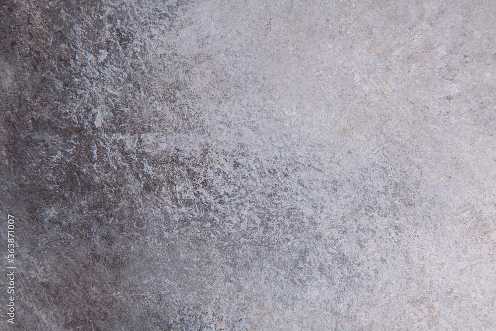 Fototapeta premium gray-brown smooth background from construction plaster on a wooden base