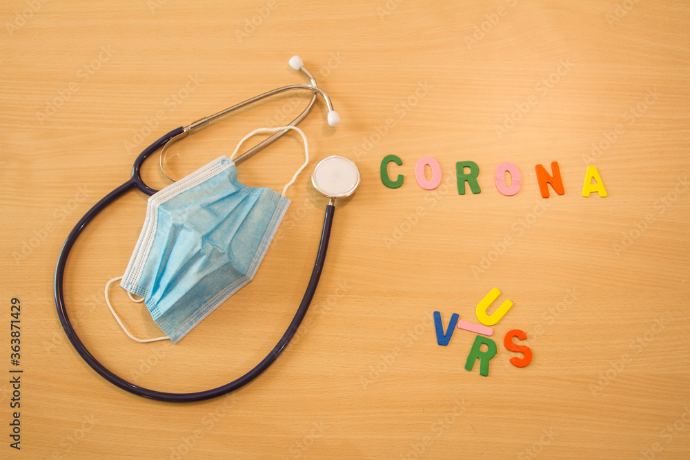 medical stethoscope on the table with scattered and colored letters writing coronavirus covid 19 medical stethoscope on the table with scattered and colored letters writing coronavirus covid 19