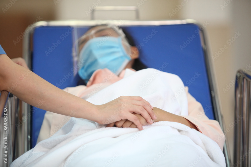 Doctor and patient wearing facemasks during coronavirus and flu outbreak. Virus and illness protection, home quarantine. COVID-2019 Doctor and patient wearing facemasks during coronavirus and flu outbreak. Virus and illness protection, home quarantine. COVID-2019